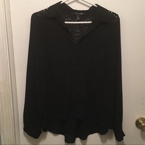 Black long sleeve blouse with lace detail on back.